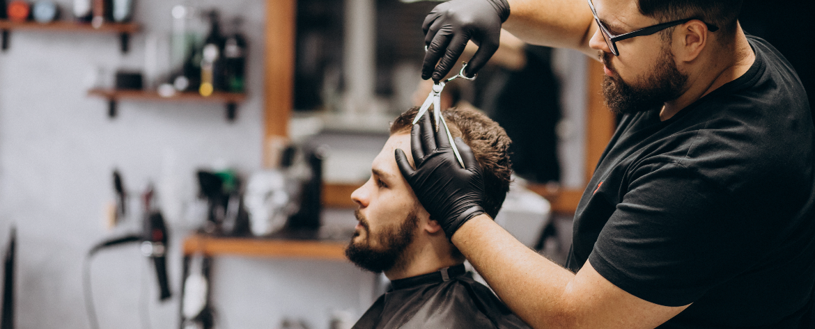 Men’s haircuts Abbotsford at Salon77—stylist delivering a precision cut for a stylish, confident look.