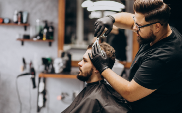 Men’s haircuts Abbotsford at Salon77—stylist delivering a precision cut for a stylish, confident look.